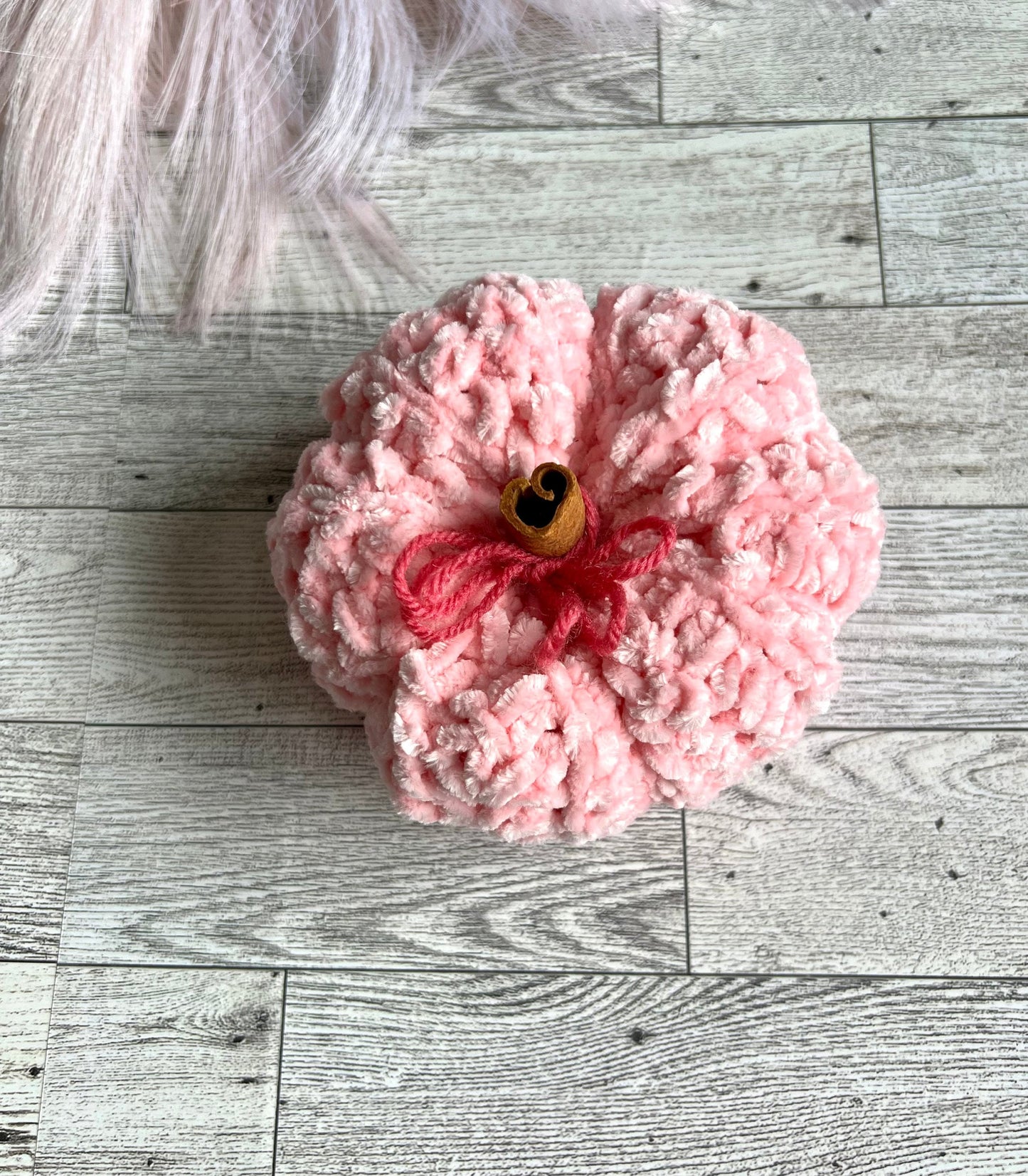 Plush Pink pumpkin decorative with cinnamon stick stem for touch of warmth