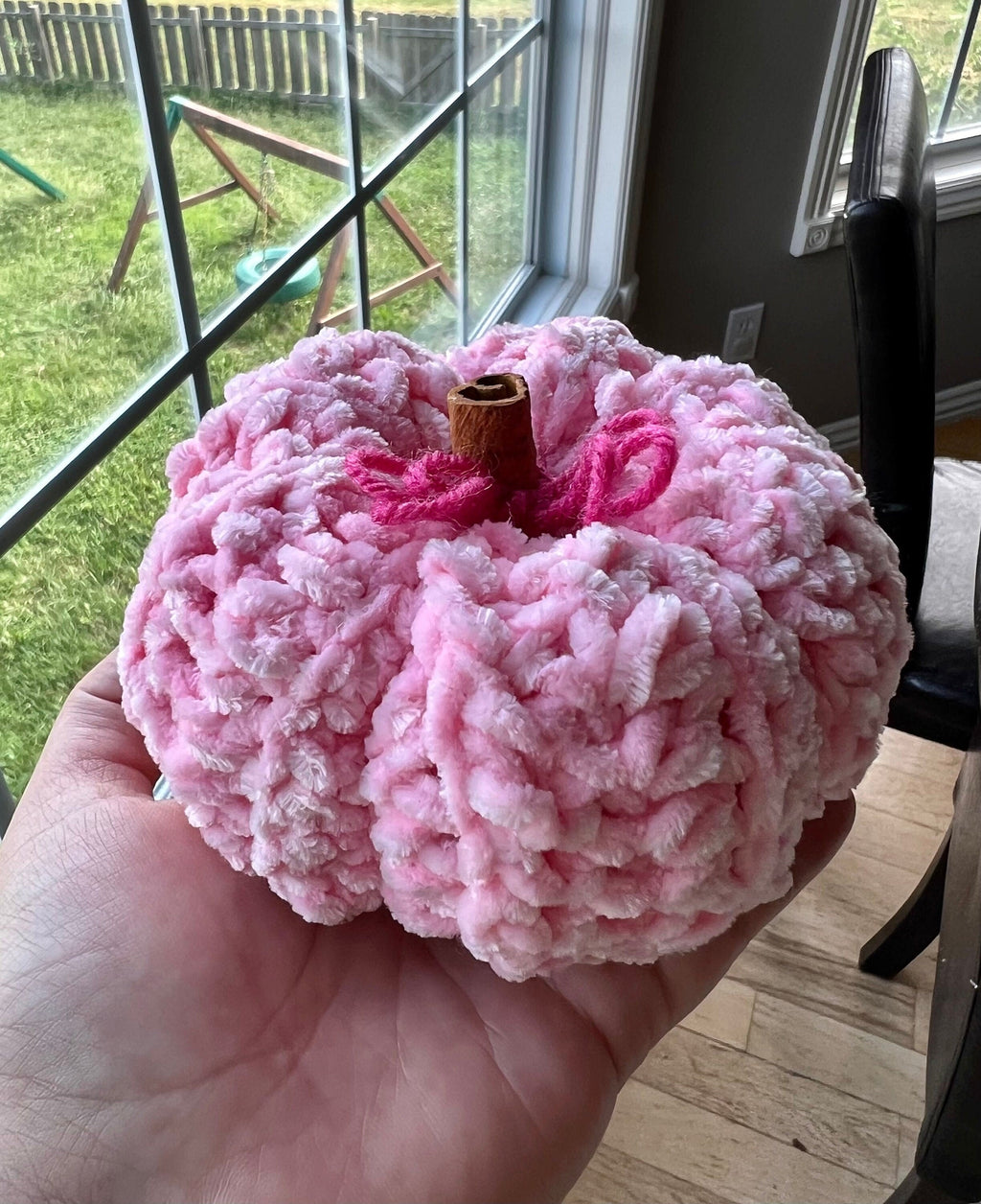 Plush Pink pumpkin decorative with cinnamon stick stem for touch of warmth