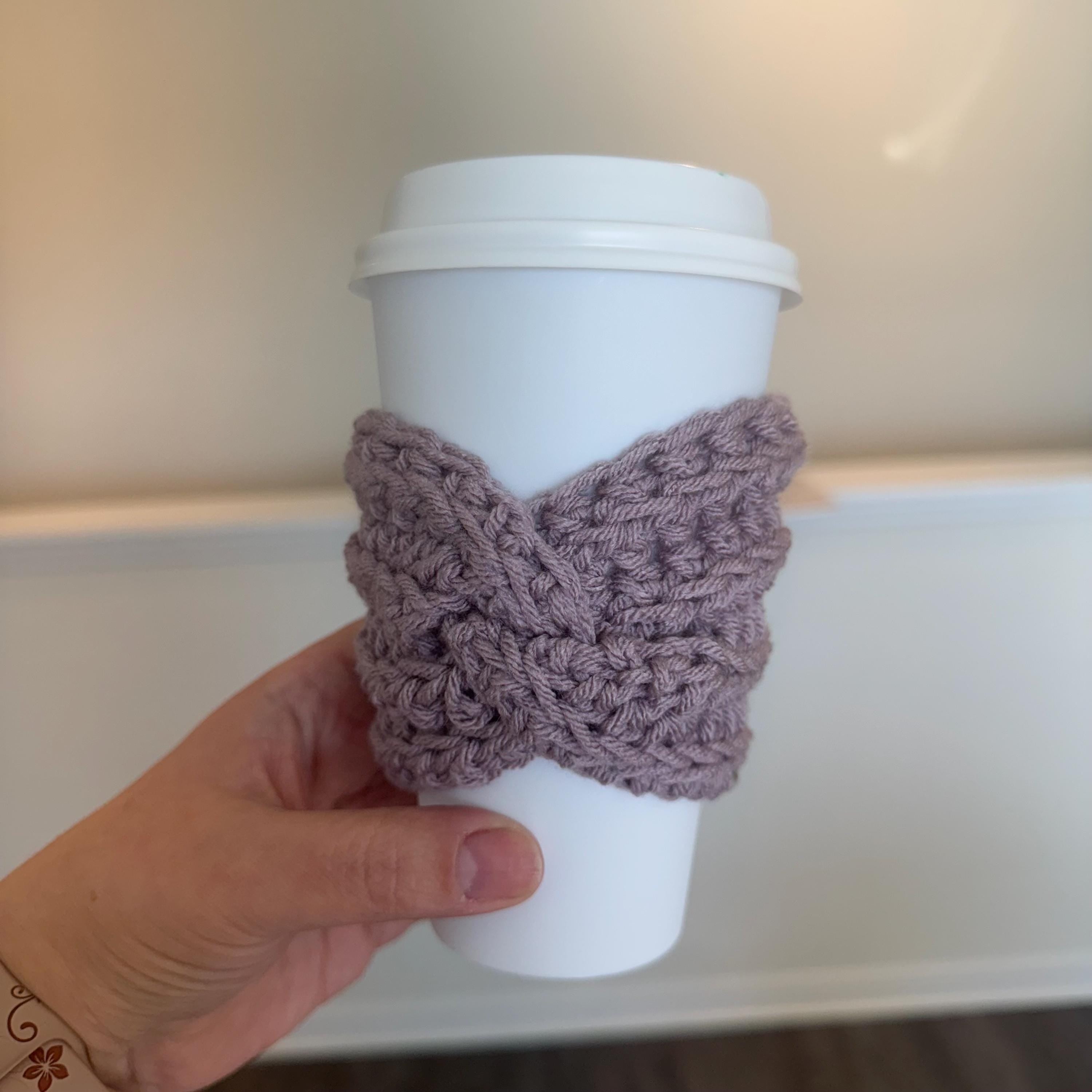 Purple Coffee Sleeve Handmade Crochet Cozy Reusable Cup Holder Beverage Protector Design Hot Drink Insulation Comfortable Hand Protection Eco Friendly Alternative Daily Coffee Essential Sustainable Lifestyle Choice Beautiful Lavender Color