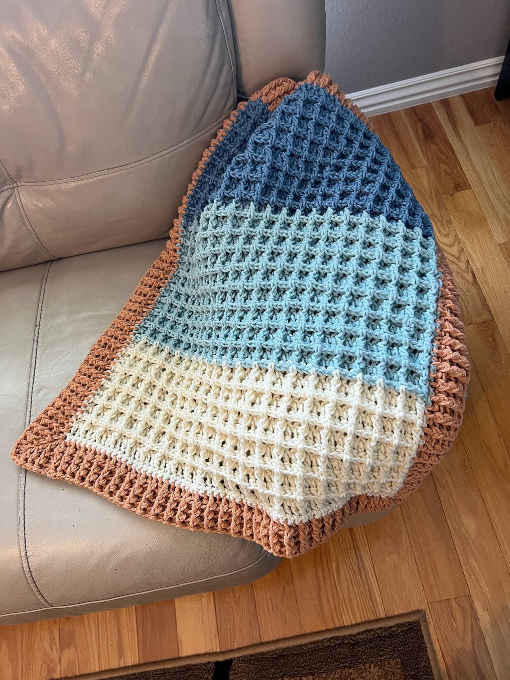 Beach Baby Blanket Boho Nursery Decor Coastal Theme Design Handmade Crochet Pattern Soft Yarn Material Blue White Beige Colors Modern Heirloom Quality Textured Surface Gentle Touch Perfect Bassinet Cover Stroller Accessory Carseat Blanket