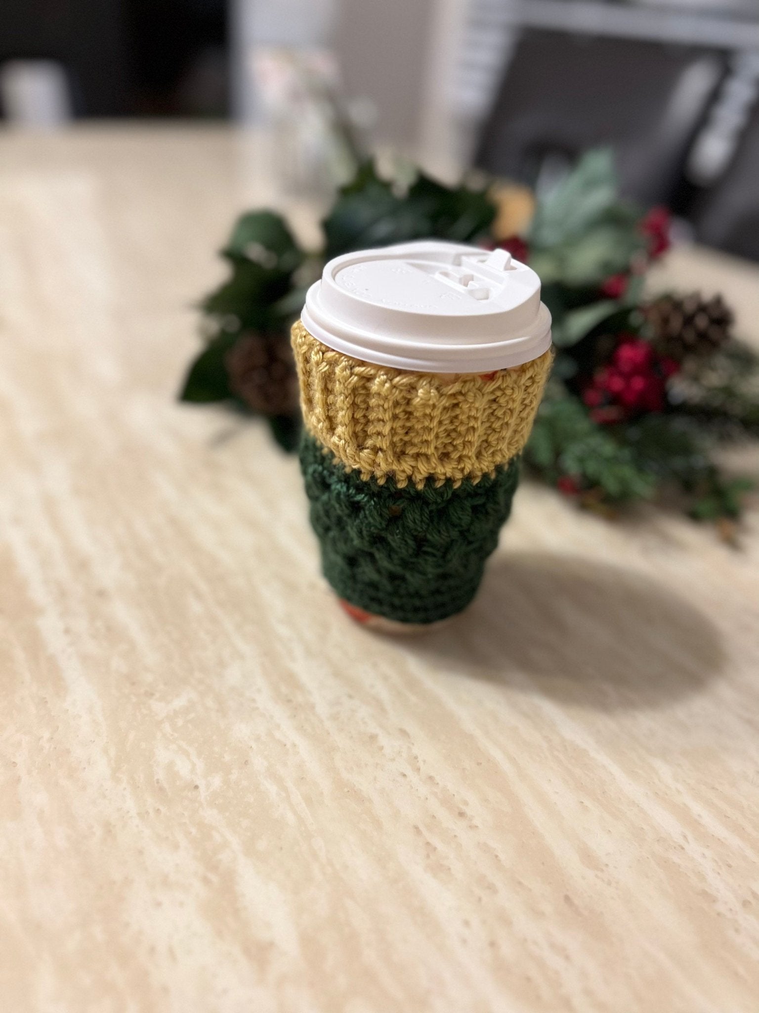 https://lillygracesparkle.com/cdn/shop/products/holiday-edition-crochet-coffee-cozy-forest-green-and-gold-634232.jpg?v=1678944926&width=1946